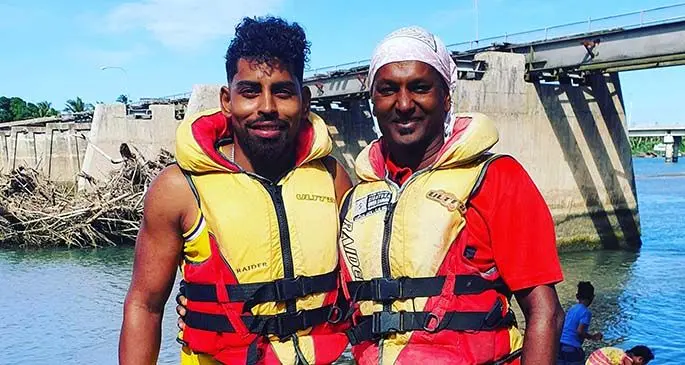Soccer star Roy Krishna (left) and a friend trying out Sigatoka’s river jet experience.