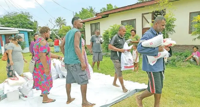 Villagers of Balenabelo in Nadroga after receiving their food rations from the Kasowaqa family on September 22, 2021. Josiua Kasowaqa with his daughter, Litia Raubeci (left) and wife, Makereta (right) in Nadroga on September 22, 2021. Members of Nabatini Settlement and Rukurukulevu Village in Nadroga with their food rations donated by the Kasowaqa family on September 22,
