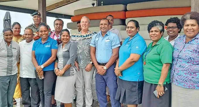 Back row from left: Major Waisale Cama, Commissioner Western, Mesake Ledua, Hilton Fiji Beach Resort and Spa general manager David Wells, OHS Security manager Ver Chand and staff members of the Hilton Fiji Beach Resort and Spa at Denarau in Nadi.  Photo: Mereleki Nai
