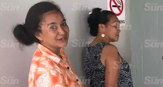 From left; Bataba Apisalome, 37, and Maere Banian, 50, outside the Suva Magistrates Court on April 26, 2020. Photo: Ilaijia Ravuwai