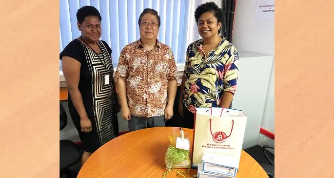 From left: Gift exchange during Xinhua delivery of Personal Protection Equipment to Fiji Sun (from left): Fiji Sun Managing Editor Business Maraia Vula, Xinhua News Agency Suva bureau chief Yongxing Zhang, and Fiji Sun Managing Editor News Rosi Doviverata. Photo: Jennis Naidu