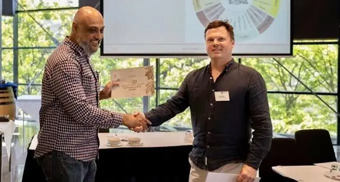 Cacao Fiji founder Arif Khan (Left) receives the recognition certificate at Adelaide, Australia. Photo: Cacao Fiji