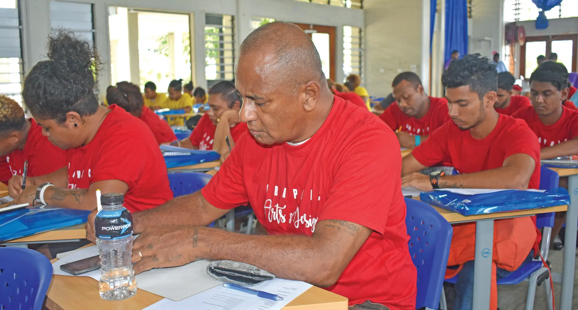 Retired civil servant Malakai Raikoti attending his first class at Nasinu campus with fellow classmates.