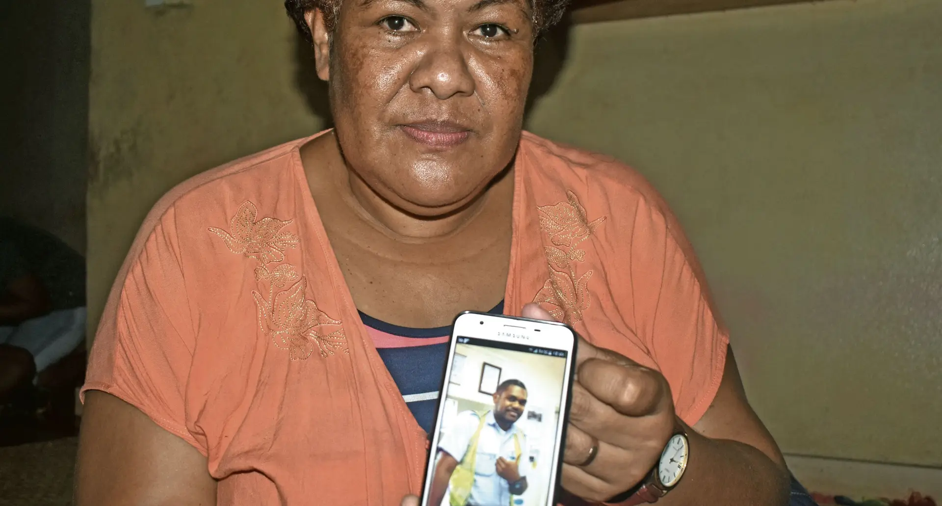 Fifty year old , Joana Bainivalu holds a photo of her late son  Pacific Flying School instructor, Iliesa Tawalo at their residence in Votualevu, Nadi on 1 March 2018 . Photo: Arieta Vakasukawaqa