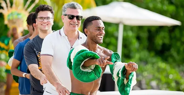 Guests of the Fiji Marriott Resort Momi Bay enjoy a dance with a staff member of the resort. Photo: Fiji Marriott Resort Momi Bay