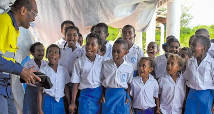 Minister for Infrastructure and Meteorological Services and Minister for Lands and Mineral Resources Jone Usamate with students of Yadua Island School. Photo: DEPTFO News