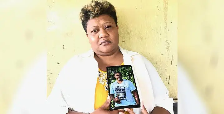 Livina Vakacoko in Soasoa Village, Labasa on January 29, 2023 showing a photo of her late husband, Seremaia Koroilagilagi. Photo: Shratika Naidu