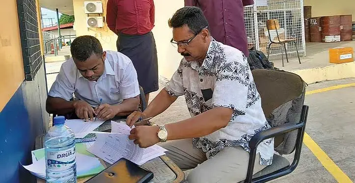 The Construction Energy and Timber Workers Union of Fiji secretary John Paul and Ministry of Employment senior north labour officer Kele Qiodrau at the EFL Labasa depot on June 4, 2023. Photo: Jone Salusalu