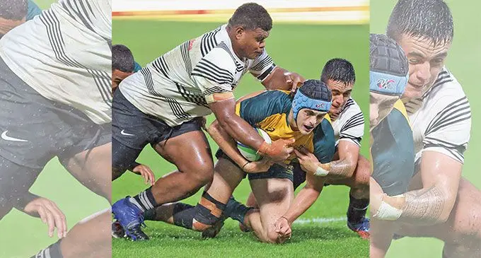 Fijian Under-20 back Tremaine Little (right) is helped by a team-mate against Australia during the Oceania competition. Photo: Oceania Rugby