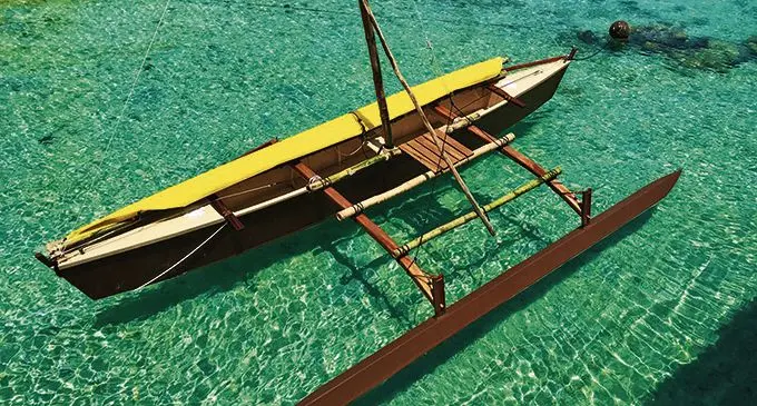 A completed traditional sailing boat ready to be used.