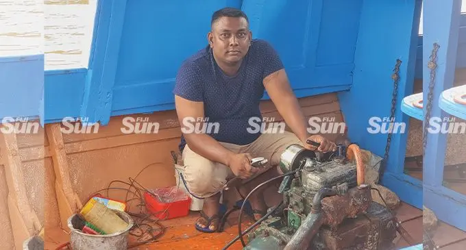 Ronald Ritesh Kumar repairs an engine on a fishing boat in Labasa Town on April 22, 2022. Photo: Sampras Anand