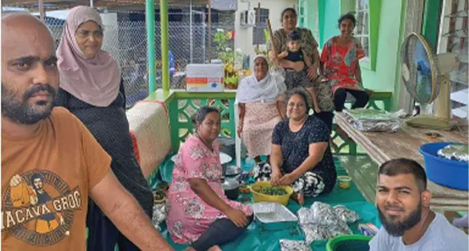 From left: Javed, Nazra, Shana, grandmother Armani, Ashfiyana, Nazmeen holding baby Zaeem and Ayaaay of Chadwick Rd, Nakasi, treated themselves to a lovo lunch to celebrate the new year. Photo: Naisa Koroi.