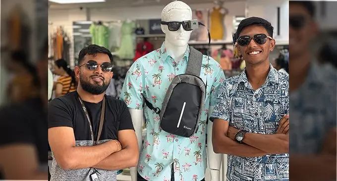 Salveen Deo and Shahil Prasad with their designed glasses for the visually impaired on the mannequin.