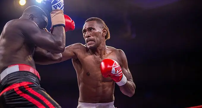 Light heavyweight boxer Apisai Naciqa (right) found his winning form in Apia, Samoa. Photo: Leon Lord 