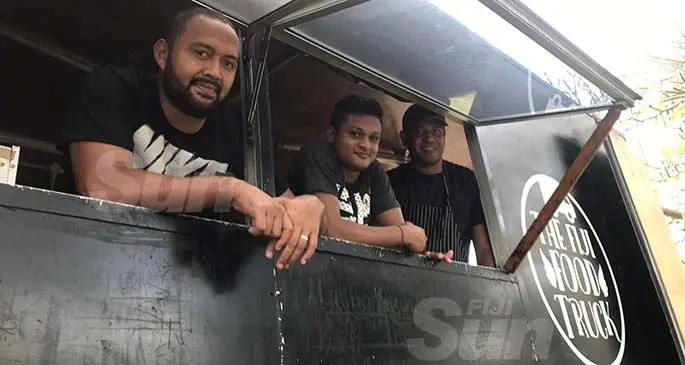 Heinrick Volmer, Monith Kumar and Pisa Seleivalu on The Fiji Food Truck at Loftus Street, yesterday. Photo: Frederica Elbourne