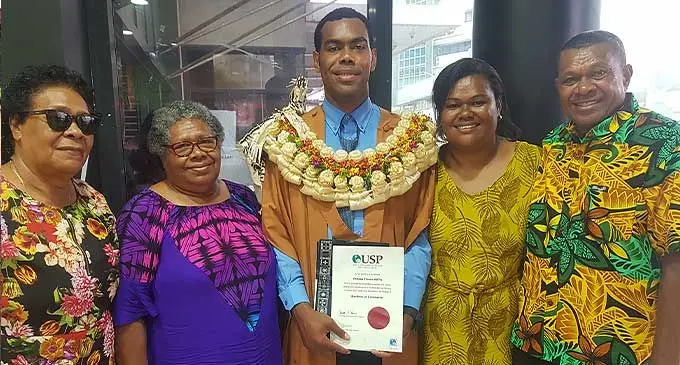University of the South Pacific graduate, Viliame Mata, is flanked by his grandmothers Lesu Sevakasiga, Vaseva Gukimaleya and his parents Kereni Nale and Solomoni Nale at MHCC in Suva on October 5, 2022. Photo: Viliame Tawanakoro