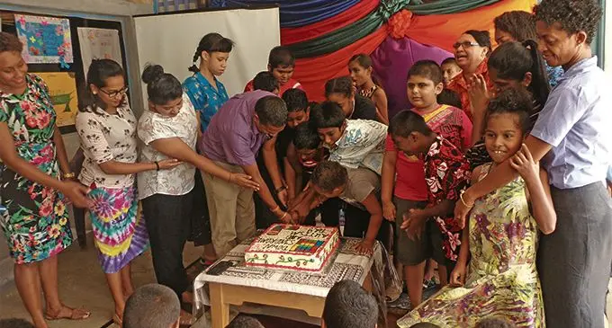 Lautoka Special School principal Kailash Pillay (in purple shirt) and students cutting the cake in celebration of World Autism Spectrum Disorder and Down Syndrome on March 27, 2019. Photo: Rohit Kumar