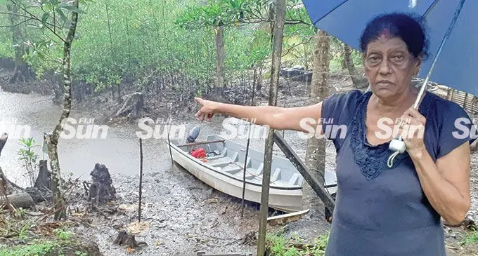 Veera Wati, 66, anticipates the safe return of her son, Roneel Kumar at the jetty behind her Naboro home on March 4, 2022. Photo: Ronald Kumar.