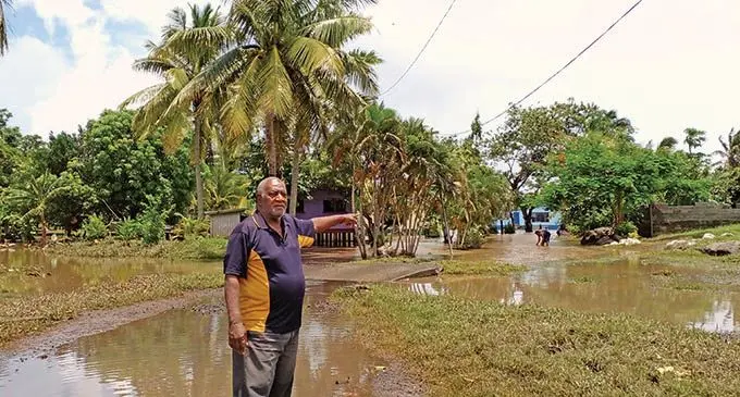 Tavualevu Village headman Nemani Waka points at a flooded area within the village under his care on January 11, 2022. Photo: Salote Qalubau