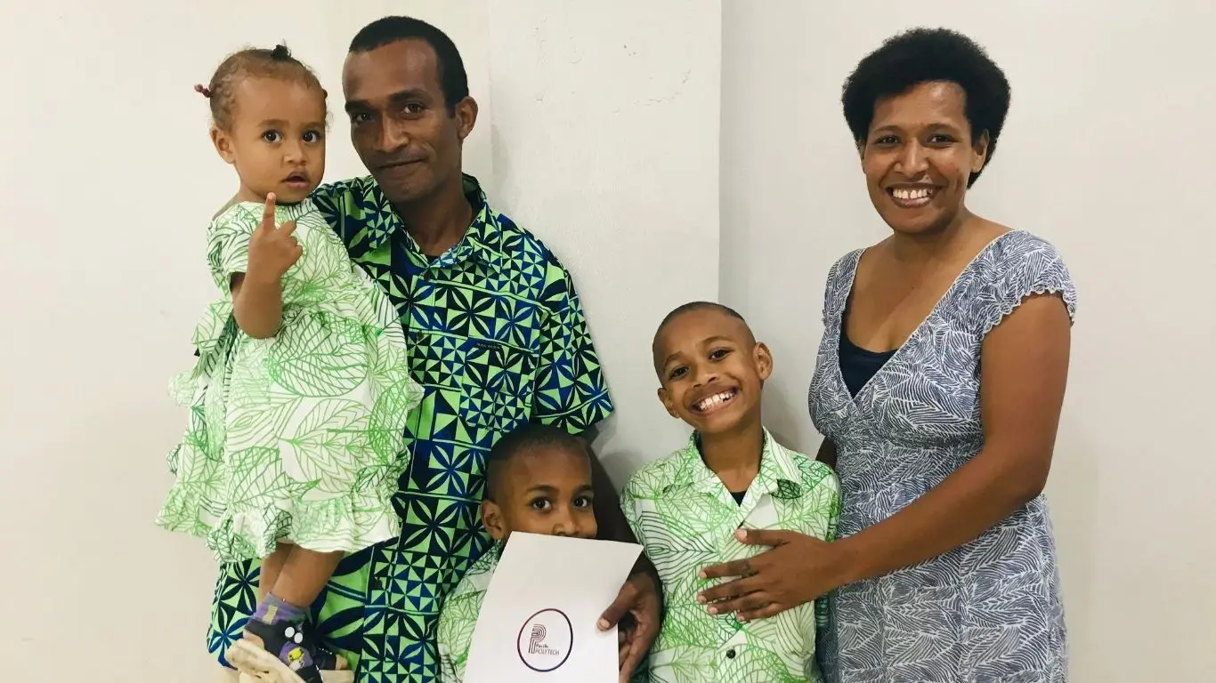 From left: Graduate Lino Raivuni with his children, Unaisi Ravuni, 1, Inoke Naitini, 6, and Vilikesa Nakoroluvu, 9, during the Pacific Polytech Cohort 6 National Qualification Graduation Ceremony at Vunimono Hall in Nausori on August 5, 2026.