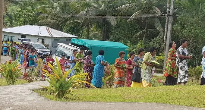 Women of Namosi District carrying the food in leaves to the halls after the meeting. The use of leaves is significant for the event as it symbolizes the people of Nabukebuke going back to their roots. Photo: Viliame Tawanakoro