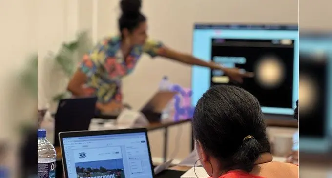 Students learning about Softr during a workshop in Suva.