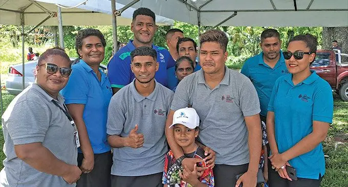 Swire Shipping Fijian Drua squad member Emosi Tuqiri (back third from left), with fans in Ba. Tuqiri was first drafted into the Vodafone Fijian Under-20 squad by then coach Koli Sewabu in 2018. Photo: Waisea Nasokia