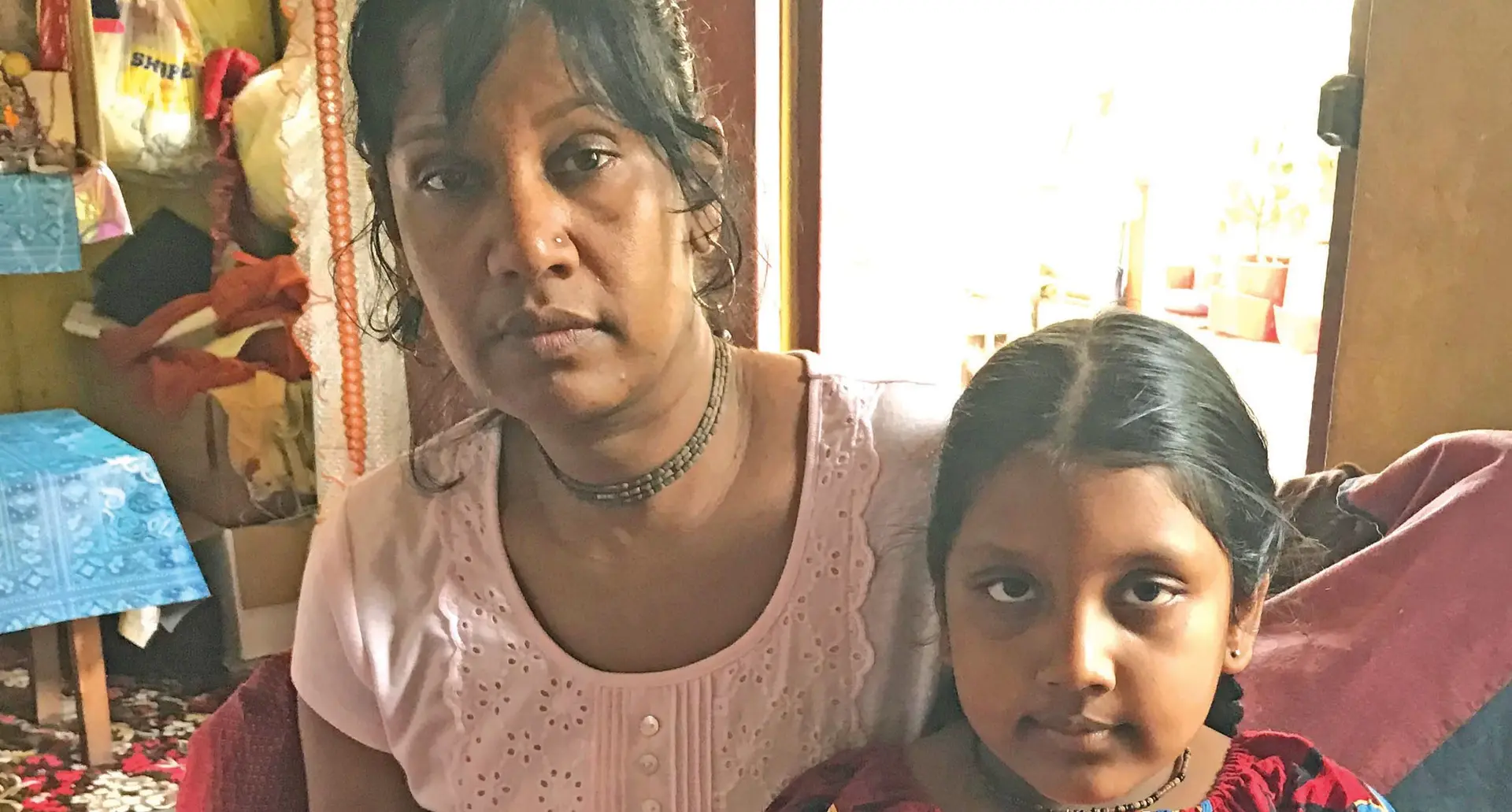Deceased taxi driver Sarwan Singh's wife Shila Wati,40, and daughter Radha Priya at their home in Nasinu Road, Valelevu yesterday.  Photo: LOSIRENE LACANIVALU.