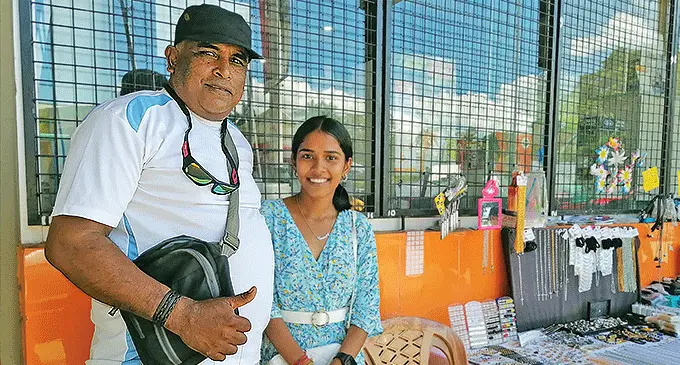 Elisha Goundar with her father, Rajendra Goundar, at their table at Nadi Town. Photo: Mereleki Nai