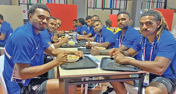Team Fiji men’s rugby sevens’ players (on the left) Iosefo Masi, Terio Tamani and Jeremaia Matana while (on the right) Selestino Ravutaumada, Kaminieli Rasaku, Jerry Tuwai, Sevuloni Mocenacagi, Ponipate Loganimasi, Jioji Nasova and Ioane Teba tuck into a hearty meal at the Olympic Games Village in Paris, France on July 20, 2024. Photo: FASANOC