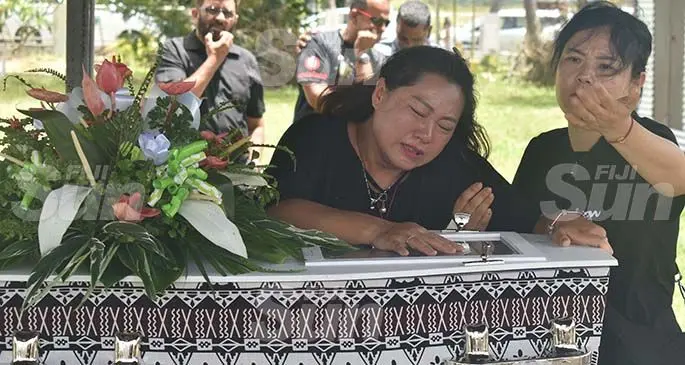 Fiance Jin Ling weeps during the funeral of Hua 'Jerry' Tao at the Nadovi cemetery outside Nadi town yesterday. Photo: Waisea Nasokia
