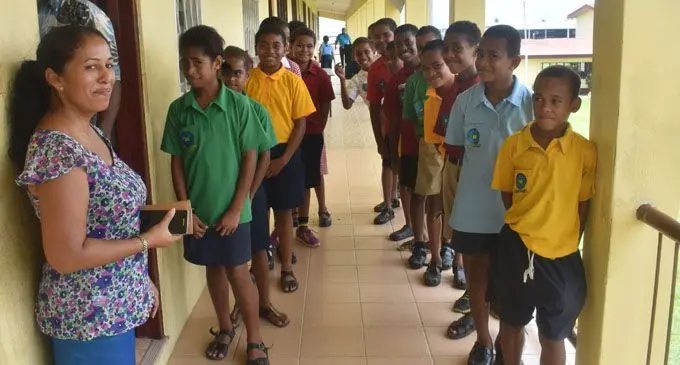 Namaka Public School students in Nadi line up to cast their votes at the school’s office on February 1, 2018. Photo: Arieta Vakasukawaqa