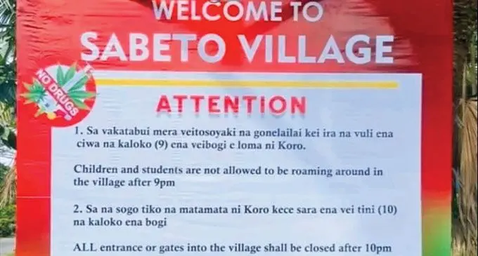 The curfew board at the Sabeto Village entrance.