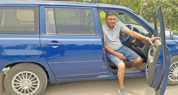 Arvind Lal inside his taxi in Suva.  Photo: Shalveen Chand