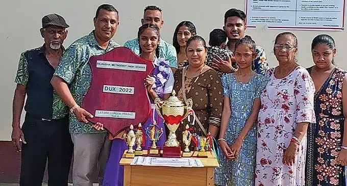 Leesha Prasad with her family during the Dilkusha Methodist High School annual prize giving celebration last Friday.