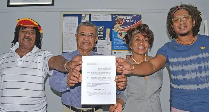 Fiji Performing Rights Association members (from left) Seru Serevi, chairperson Saimoni Vuatalevu, Laisa Vulakoro and Inoke Kalounisiga with the copy of the court judgment on July 2, 2019. Photo: Ronald Kumar