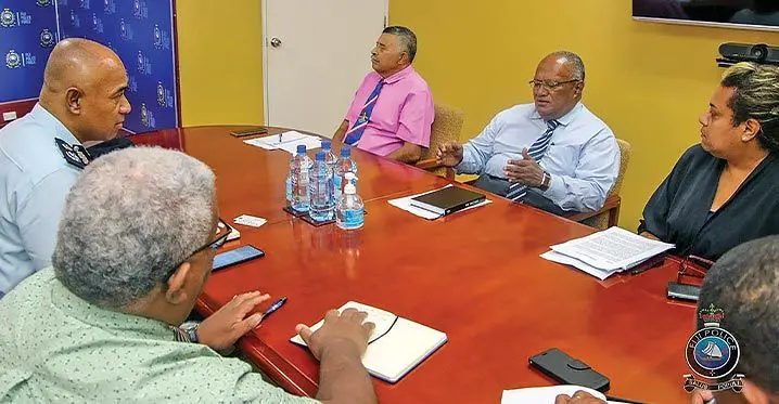Former Fiji ambassadors Mosese Tikoitoga (pink shirt) and Isikeli Mataitoga, with Acting Police Commissioner Juki Fong Chew (far left) at the Fiji Police Force headquarters in Suva. Photo: Police media cell