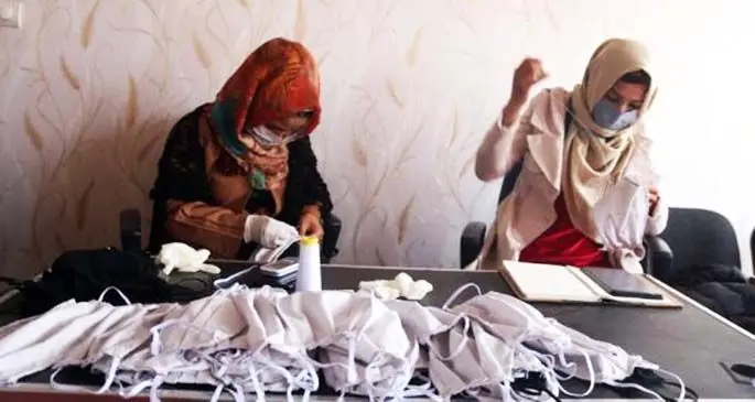 Afghan women make facemasks at a tailoring shop in Sari Pul province, Afghanistan, April 13, 2020. (Photo by Mohammad Jan Aria/Xinhua)