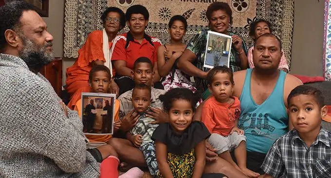 Mum Salome Voliti (back) holds a picture of her son Sailasa Laudola as family members show their support at Korovuto Village in Nadi on July 27, 2019.  Photo: Waisea Nasokia 