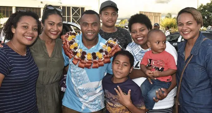 Fiji Airways Fijian 7s rep Alosio Naduva with fans at the Nadi International Airport on February 6, 2018. Photo: Waisea Nasokia