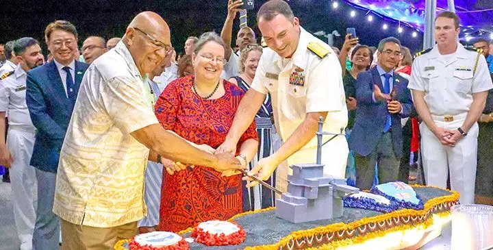 Prime Minister Sitiveni Rabuka, Ambassador Marie Damour, and U.S 7th Fleet Deputy Commander Rear Admiral Mark Gantt during the cake cutting. Pictured bottom right: Crew members of USS Blue Ridge during the United States early Independence Day celebration aboard the USS Blue Ridge at Suva Wharf on May 7, 2025. Photos: DEPTFO News
