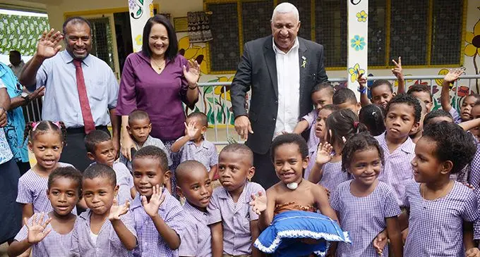 From left- Minister for Health Dr. Iferemi Waqainabete, Minister for Education Rosy Akbar and Prime Minister Voreqe Bainimarama with Suvavou Kindergarten students after the opening on August 12, 2020.  Photo: Ronald Kumar