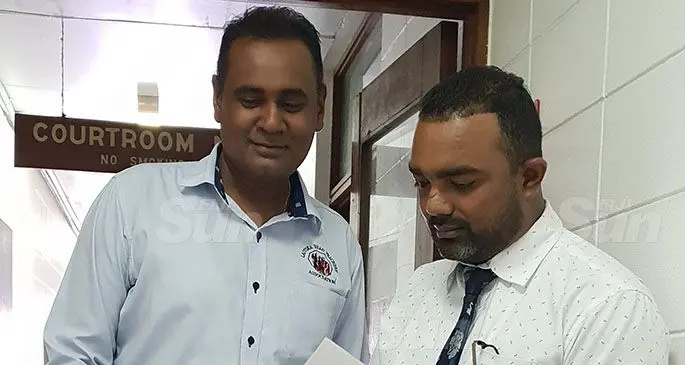Shelvin Sailesh Prasad (left) with his lawyer, Salvin Nand (right). Photo: Nicolette Chambers