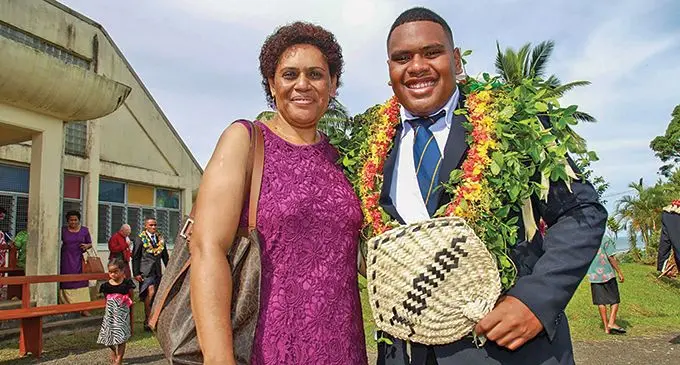 Ratu Kadavulevu School deputy head boy Apenisa Cavuilati with his mother Betty Cavuilati after the school’s prefects induction at Lodoni, Tailevu on May 1, 2022. Photo: Leon Lord