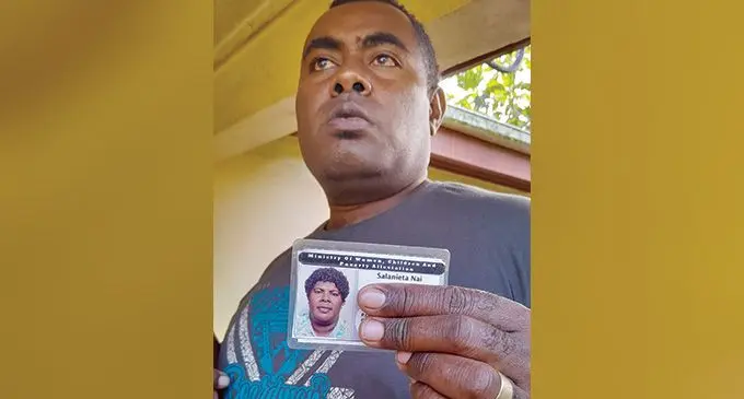 Sakiusa Gasaucalayawa holds a photo of his late wife Salanieta Nai at their residence in Nabila village, Nadroga. Photo: Waisea Nasokia