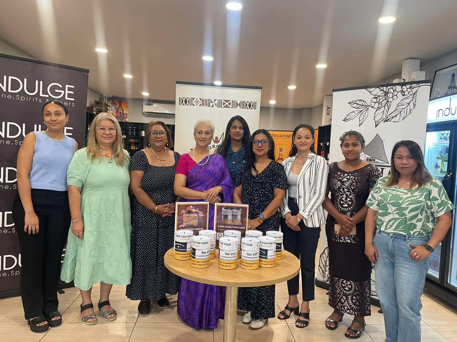 Staffs from Corona Fiji, together with Indulge Wines and Fiji Coffee, during the launched of the cans and clothing's bins donations on April 9.