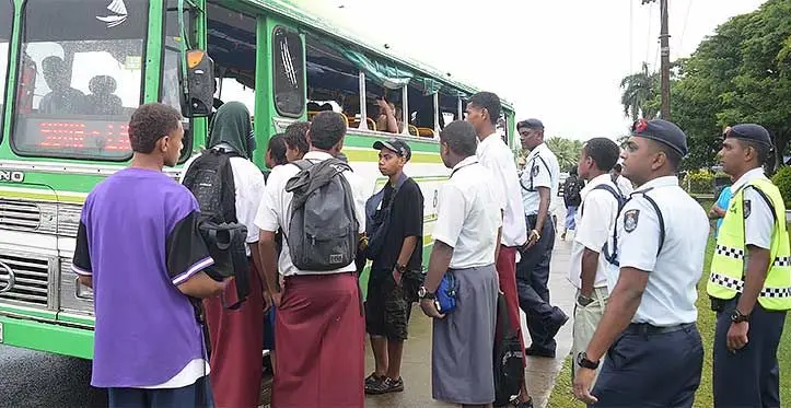 Police officers ensure the safety of students as they board a bus near the HFC Bank Stadium following the Suva Zone 1 athletics competition on April 18, 2023. Photo: Ronald Kumar