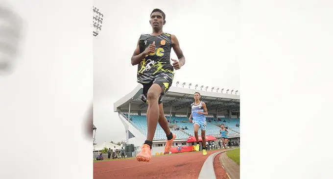 Kunal Ram of Labasa Sangam College wins the Maritime Zone’s 1500 metres race at HFC Bank Stadium on August 16, 2022. Photo: Ronald Kumar.