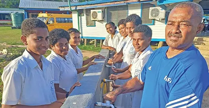 Nadogo Central College manager Solomone Catarogo (right), with the students waiting for water in Macuata on September 13, 2023. Photo: Shratika Naidu