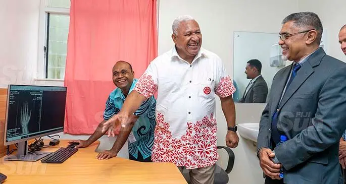 Prime Minister Voreqe Bainimarama (middle )and Ministry of Health Permanent Secretary Dr James Fong at the launch of the new digital X-ray machine on January 27, 2021. Photo: Leon Lord